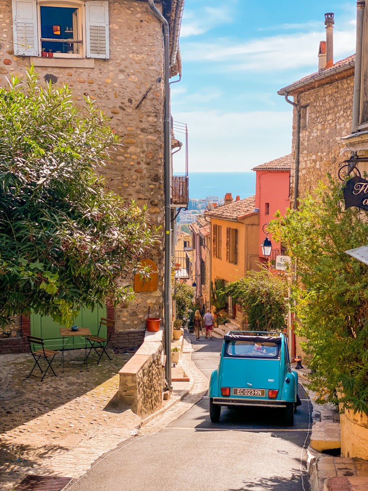 Blue 2CV going down hill Haut-de-Cagnes Medieval Village