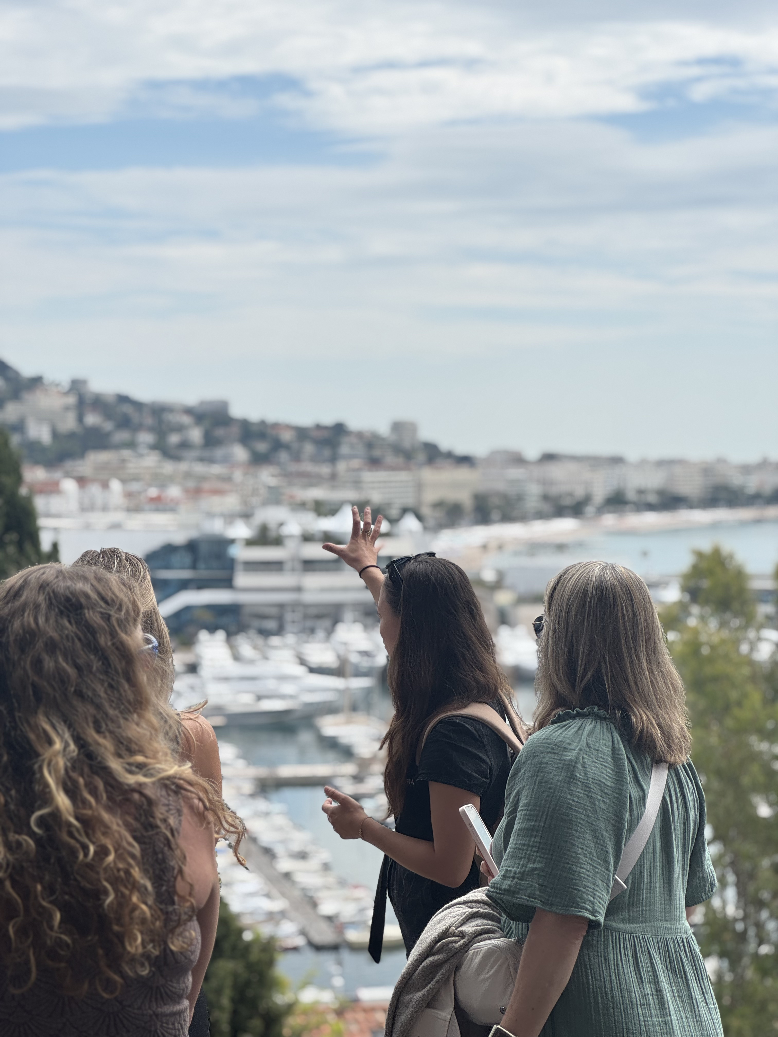 Tour guide Le Suquet view over Cannes explaining the Port and Palais des Festivals